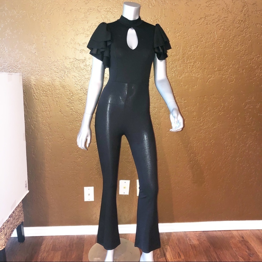 Papayon Poly stretch jumpsuit and ruffle sleeves.